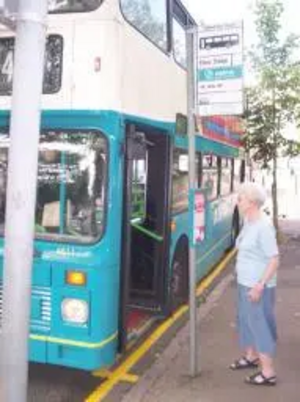 Pensioner at bus stop in Leicester