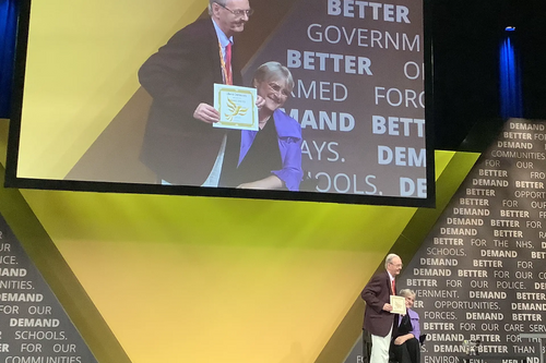 Bernard Greaves collects the Presidents Award from Party President Sal Brinton