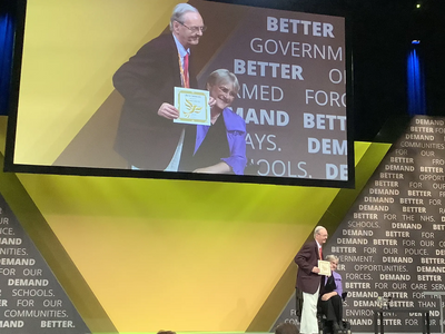 Bernard Greaves collects the Presidents Award from Party President Sal Brinton