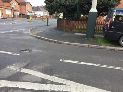 Deep Dale in Evington Ward. Liberal Democrats reported to Leicester City Council the pothole forming at the junction with the busy Green Lane Road