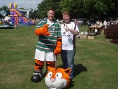 Robin Webber-Jones dressed as a Tiger's Mascot with Cllr Dale Keeling who organised the fun day.