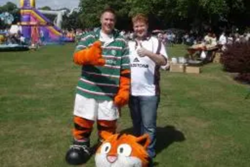 Robin Webber-Jones dressed as a Tiger's Mascot with Cllr Dale Keeling who organised the fun day.