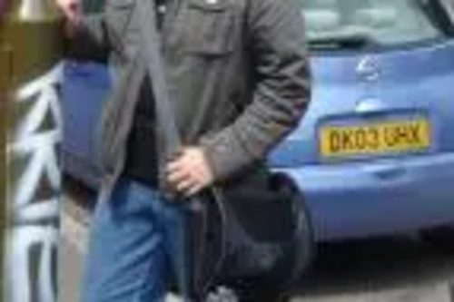 Allan Macaffery inspects another vandalised lampost on Kington Lane East.