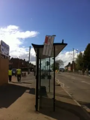 Loose Bus Stop Sign outside Holy Cross Primary School, Eyres Monsell Ward