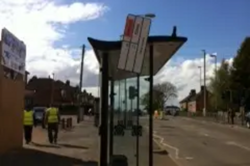 Loose Bus Stop Sign outside Holy Cross Primary School, Eyres Monsell Ward