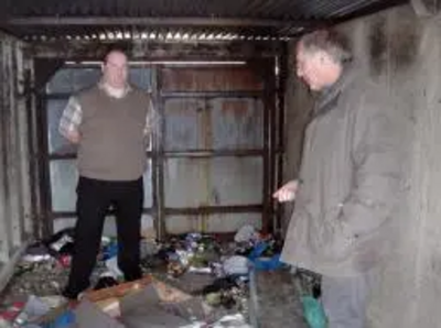 Peter Coley with Simon Sansome inspecting criminal damage