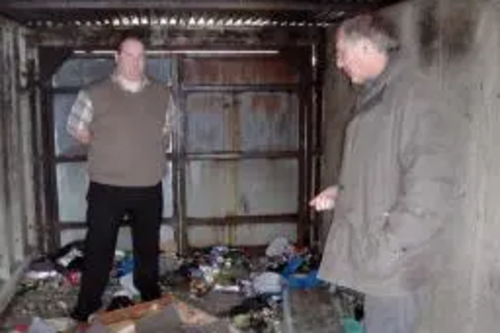 Peter Coley with Simon Sansome inspecting criminal damage