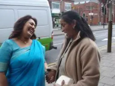 Josh Ramji (left) speaking to a local Belgrave resident on Melton Road.