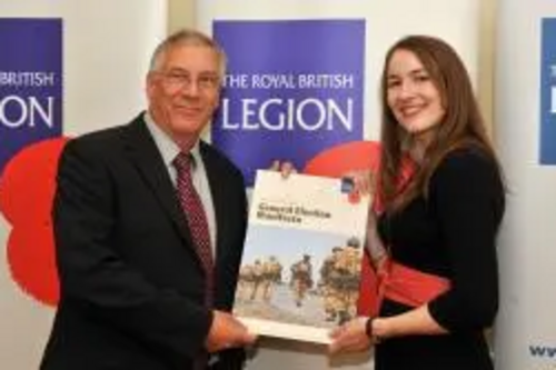 Peter Coley signs the pledged to do his bit for the British Armed Forces family